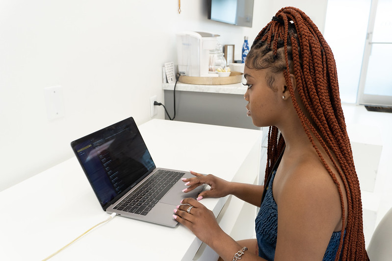 A woman working on a laptop